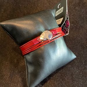 Red bracelet w/silver hardware and magnetic closure.